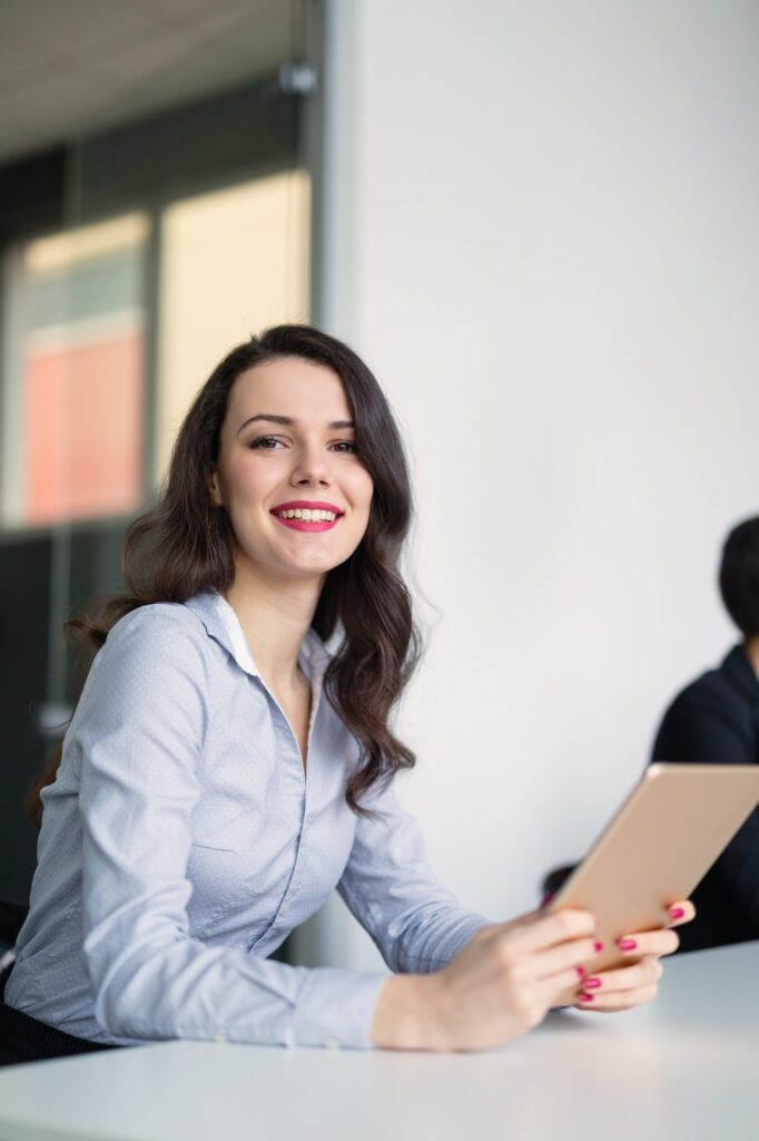 beautiful businesswoman using tablet to gather information in of e1625114402155.jpg